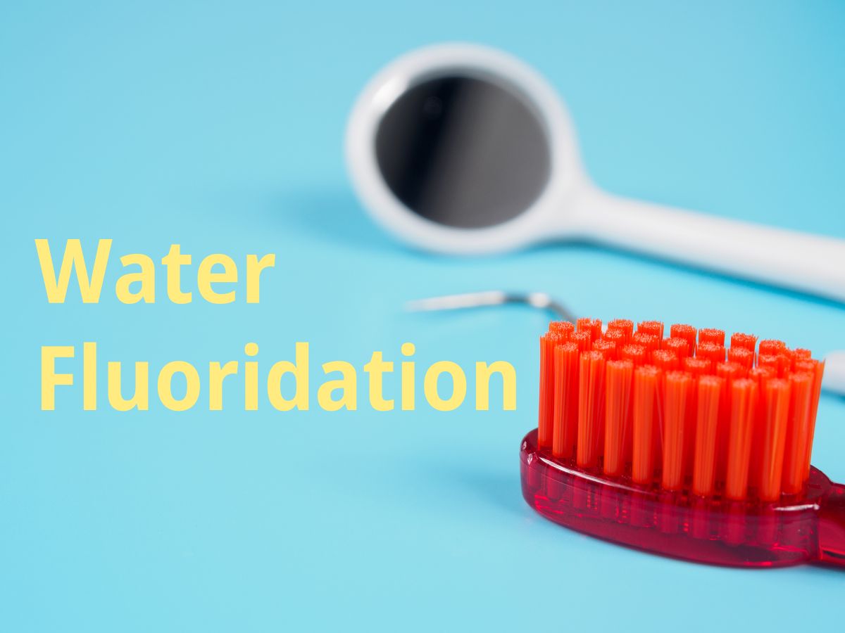 Water Fluoridation photo of dental mirror and toothbrush